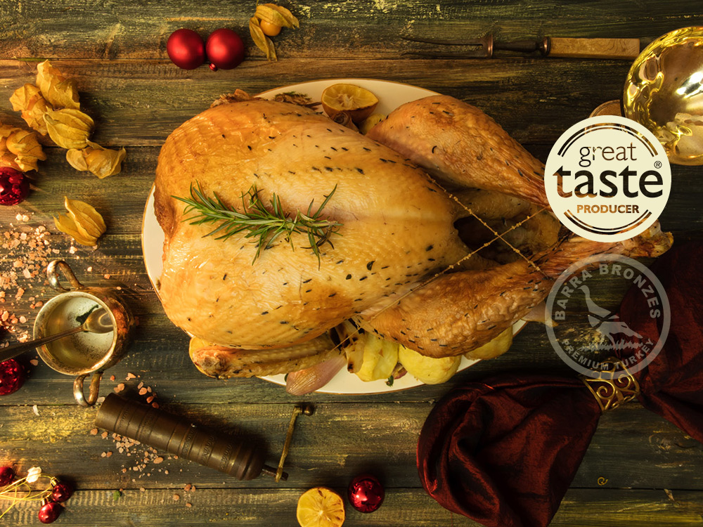Roasted turkey on a plate with garnishes, surrounded by festive decorations and spices.